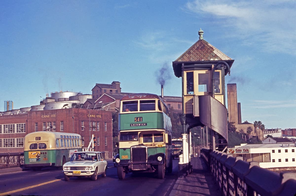 DGT Leyland OPD2-1 2310 with a body built by Comeng in 1949 on Route 541 Chiswick and AEC Regal IV 3033 Comeng in 1958 on Route 401 York Street City going the other way, coming off the Glebe Island Bridge towards Victoria Road, White Bay. 24th February 1971. Photographer: John Ward. Image courtesy of City of Sydney Archives