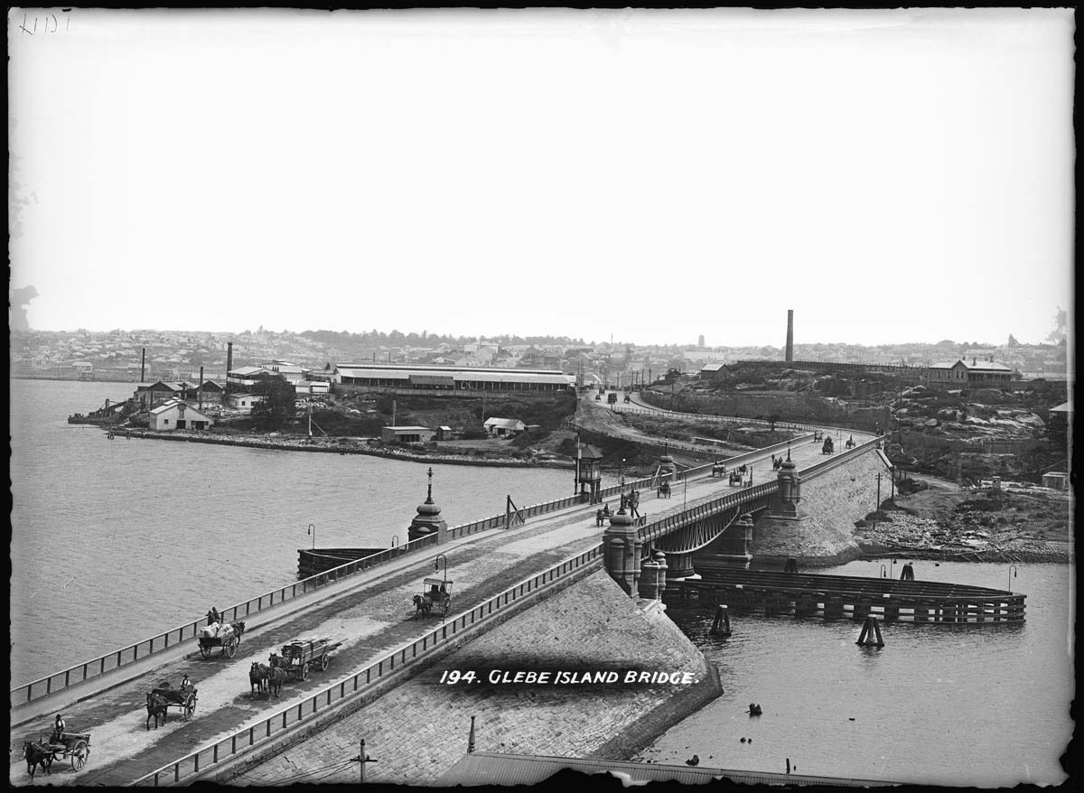 453430 Glass plate negative of Sydney's Glebe Island swing bridge with Glebe Island abattoir in the background, 1903-1915. Image: MAAS